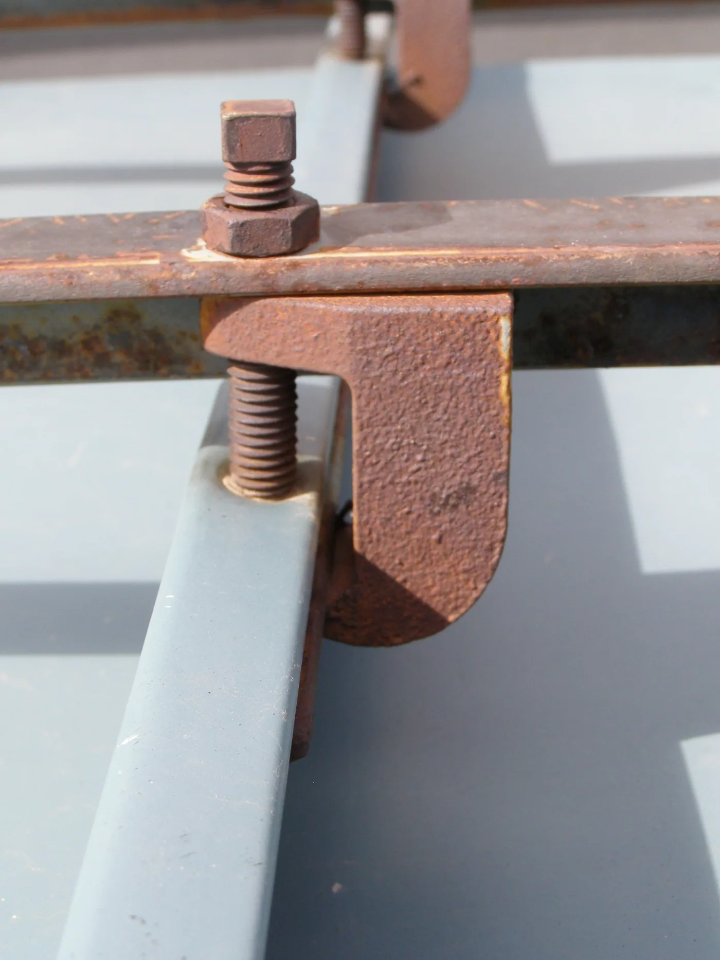 Early 1990 bar-style snow retention system developed by metal roof installer Jim Huff