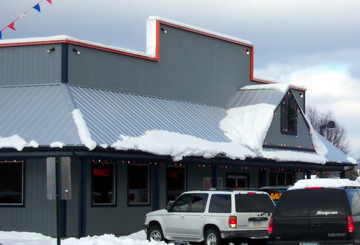 Although this eave is only a few feet high, it can still avalanche hundreds of pounds of snow and ice in seconds on a vehicle or an unsuspecting pedestrian