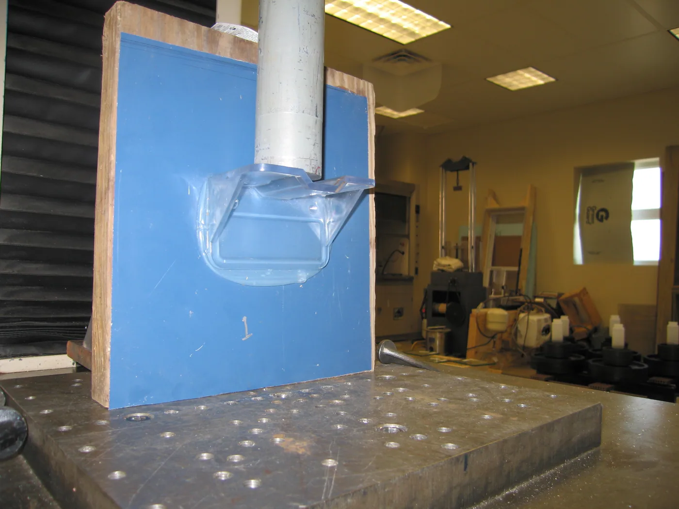 Architectural Testing Inc. test of an adhesive-mounted polycarbonate snow guard to 1,561 pounds