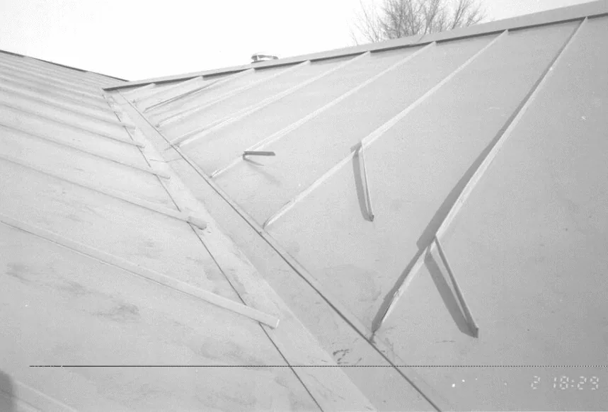 “ Flow of snow down valleys can bend the standing seams of metal roofing (figure 12), reducing their strength and violating their waterproofing integrity.”