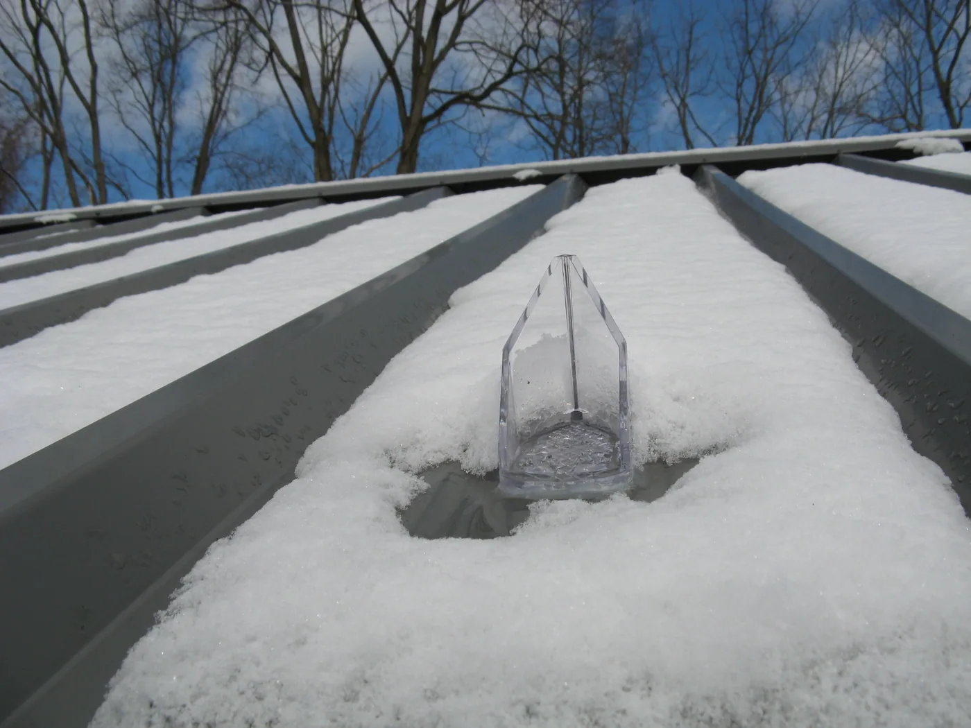 Alternate view of snow breaker guards used for controlled snow shedding