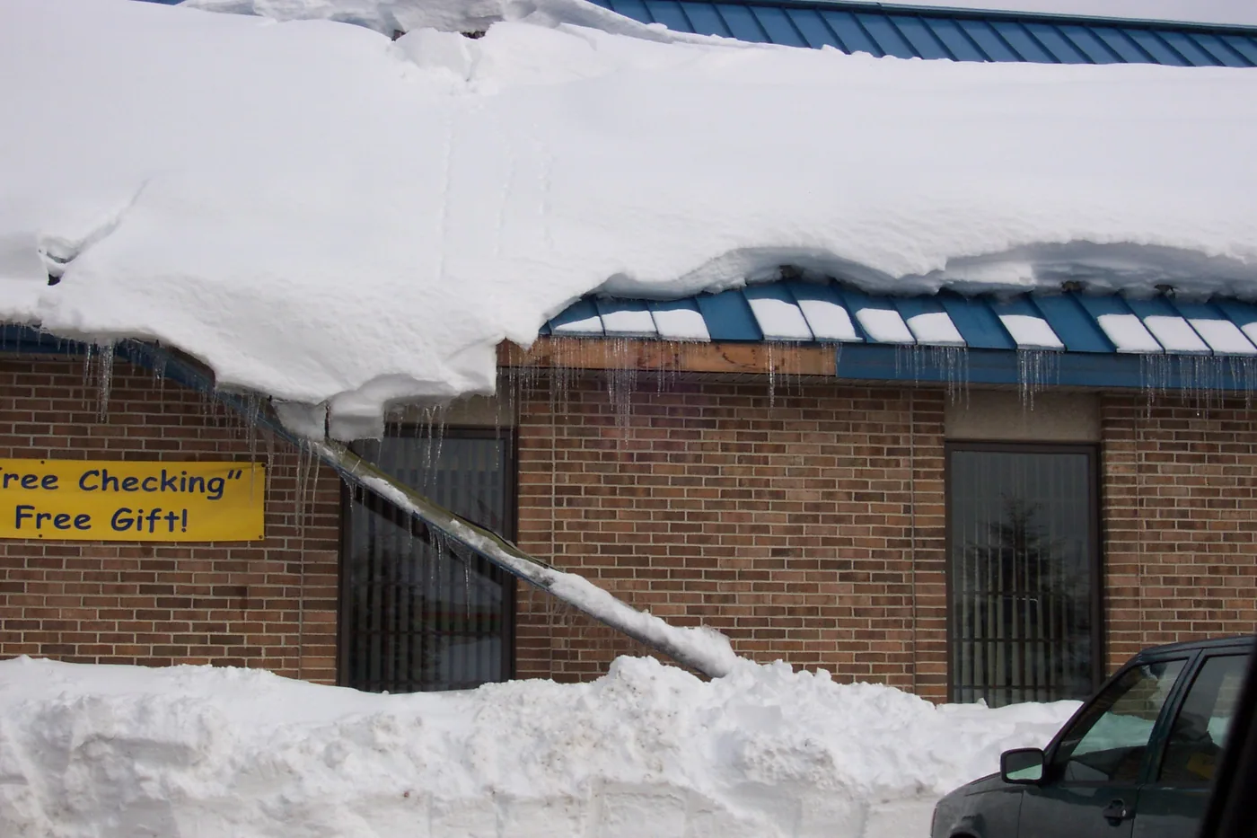 gutter damage was a result of improper use of seam mounted snow guards