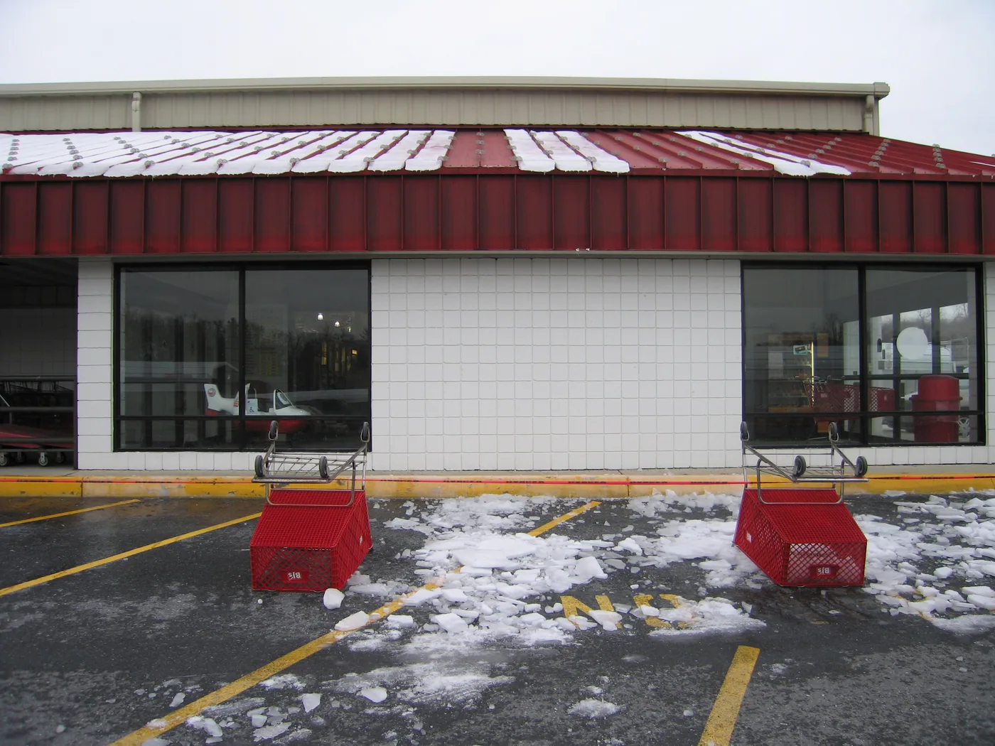 In this example, multiple rows of seam mounted snow guards still can’t prevent snow and ice from sliding dangerously into the parking lot
