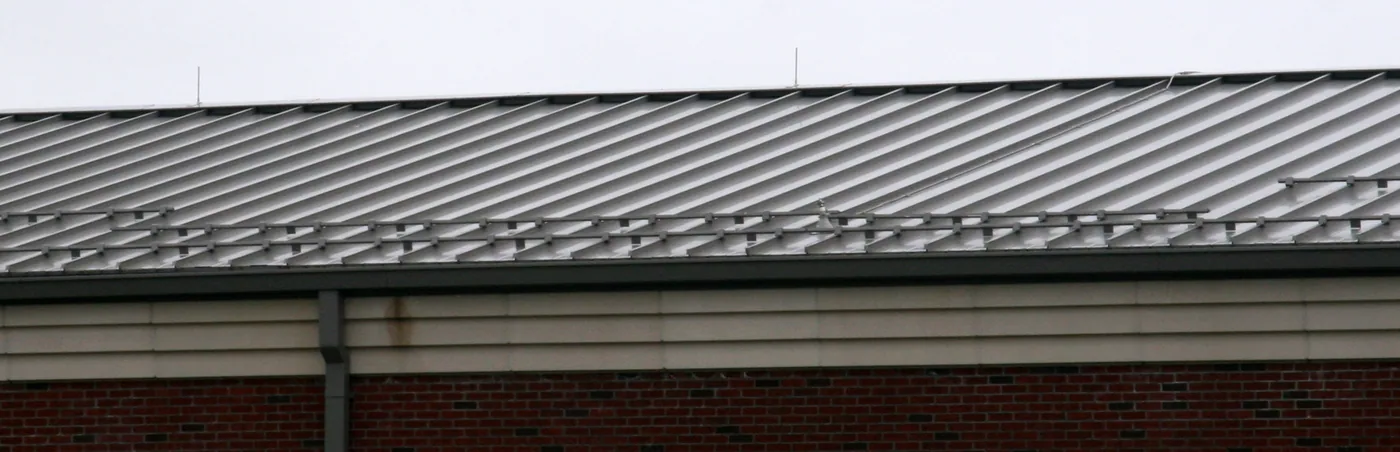 Proper row spacing and a bar system with clamps that utilize set screws to permanently attach to the seams will prevent this type of failure