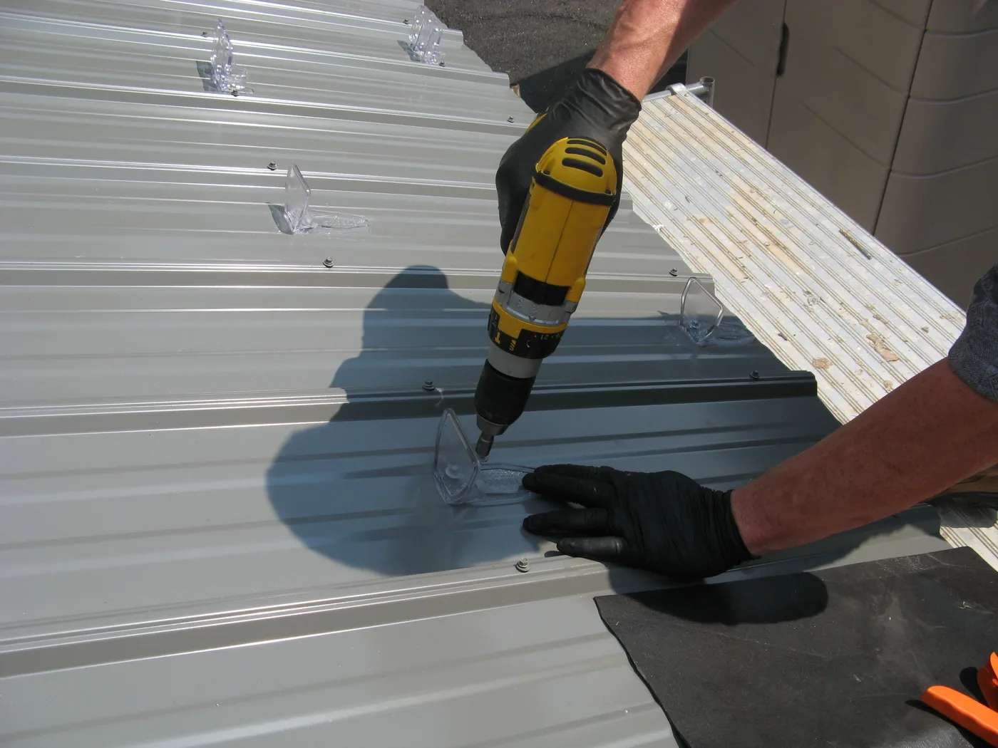 the rows are staggered where the screws go into the purlins
