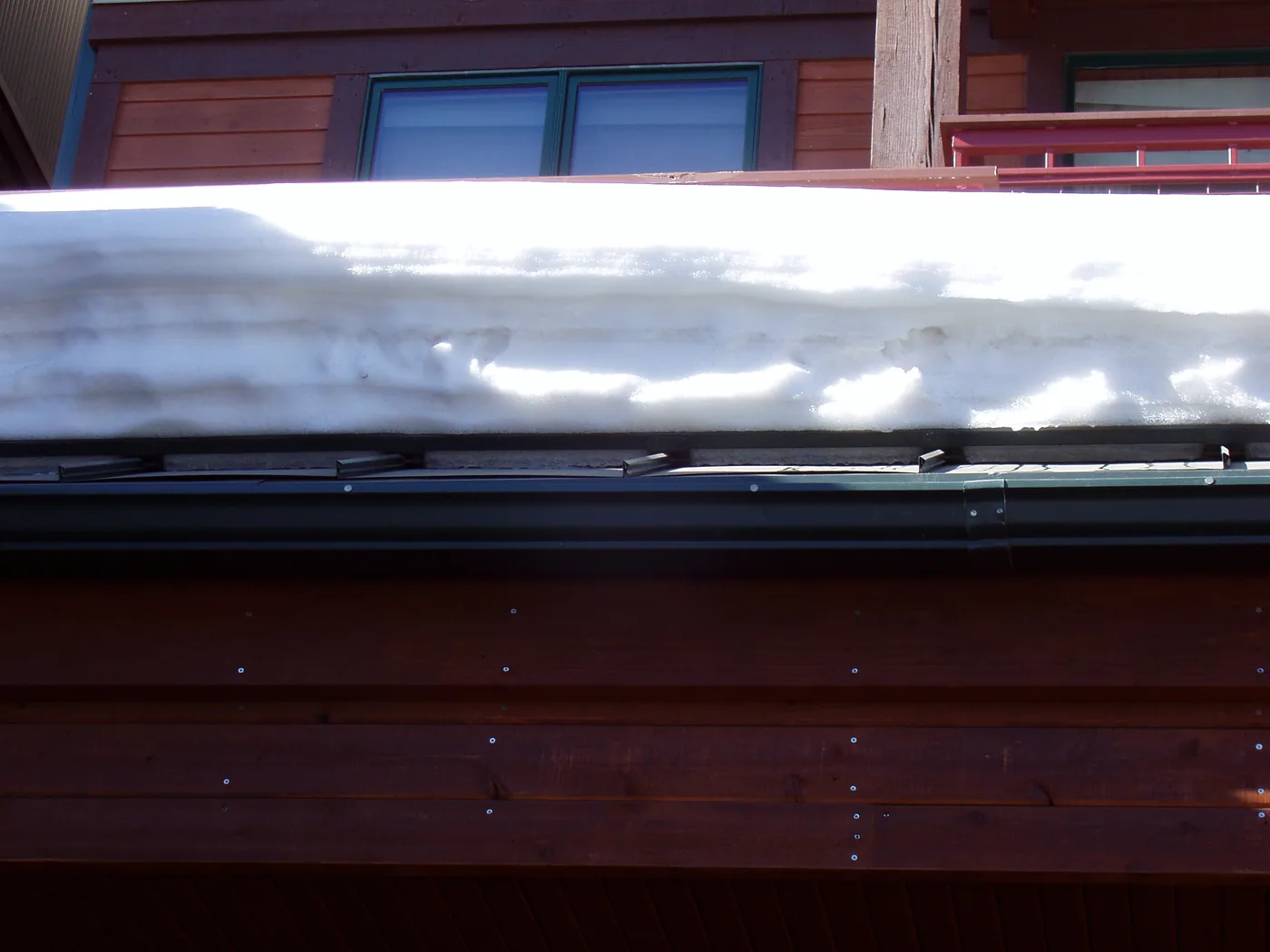 an example of how a simple single bar can effectively and safely hold back thousands of pounds of snow and ice