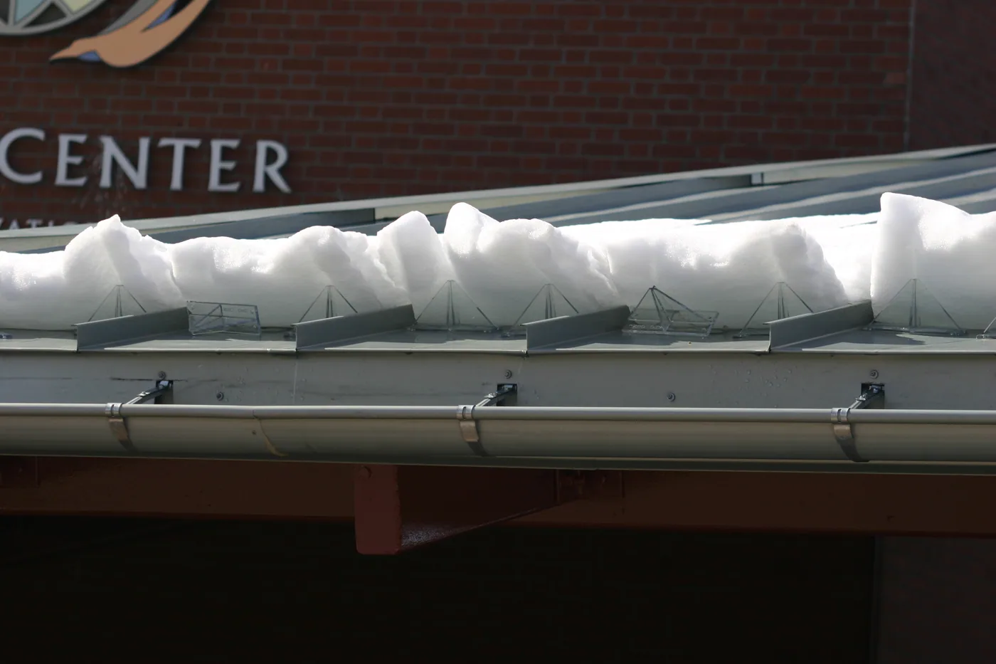 Alternate view of snow guards screwed through a concealed-fastener roof panel