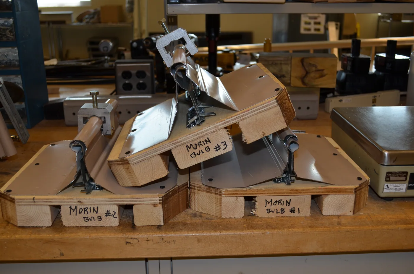 Stack of test panels during clamp testing on a bulb seam