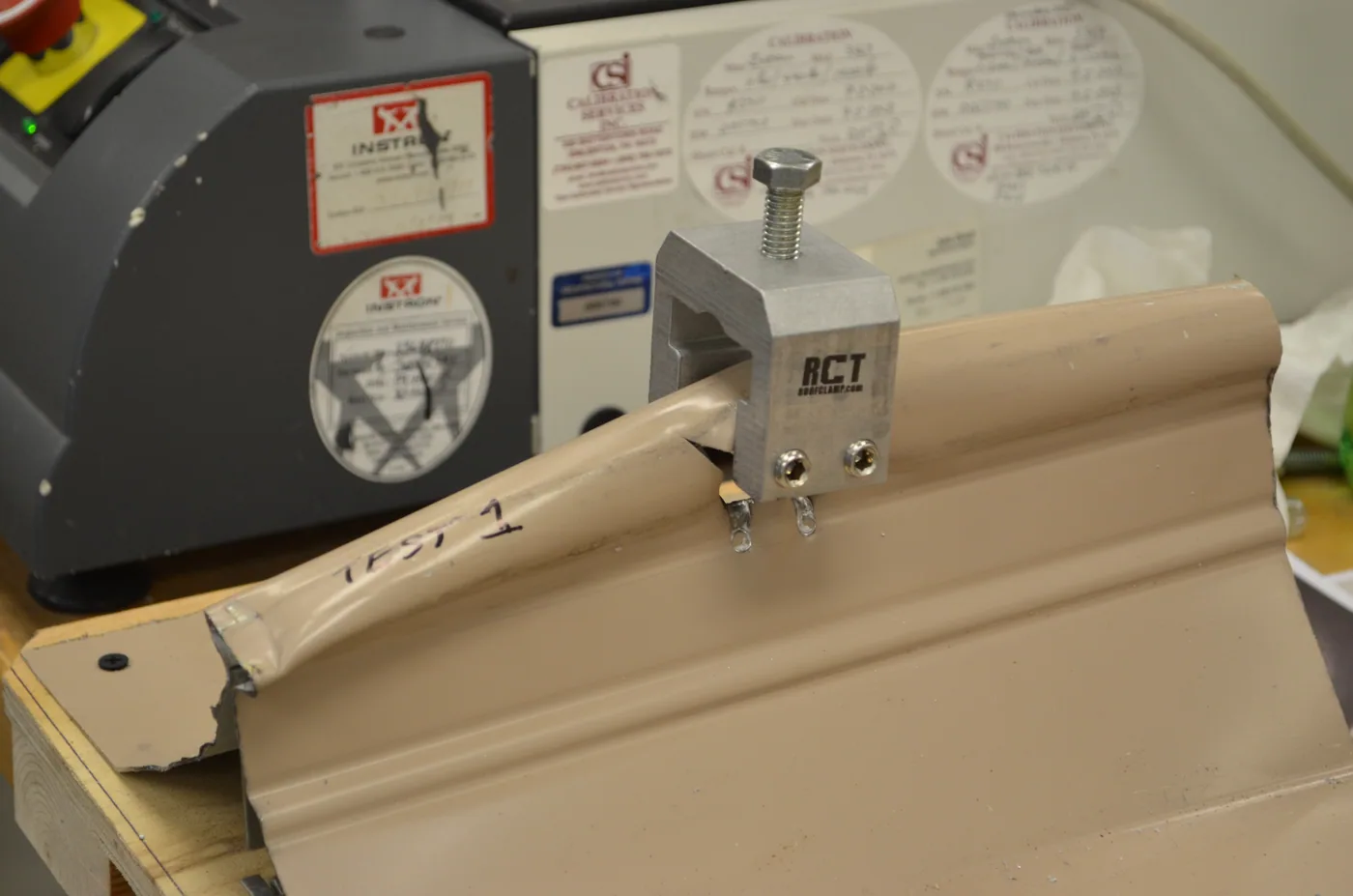 test picture illustrates a few important facts: Roof clamps are exceptionally strong and will destroy seams if not properly used