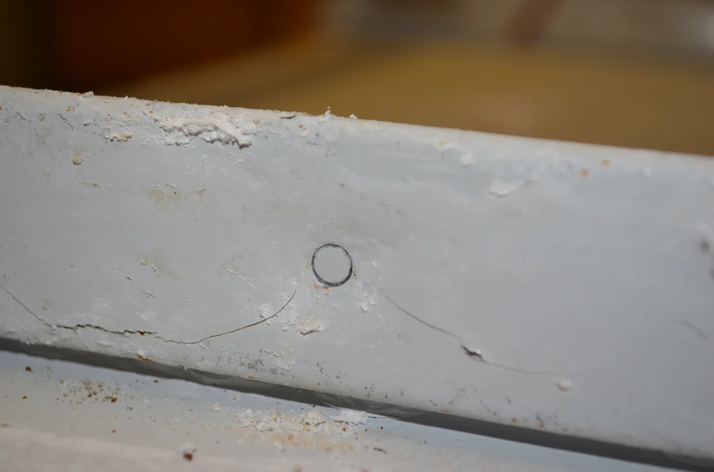 Alternate view of a cupped-tip set screw attachment point on a metal seam