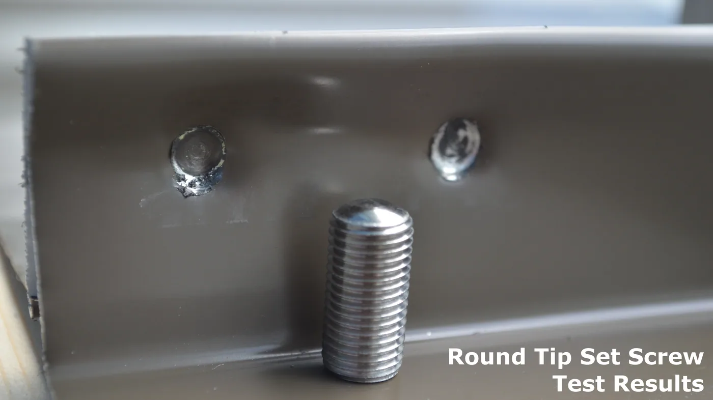 Round-point set screw test showing scratching and deformation of a metal roof seam