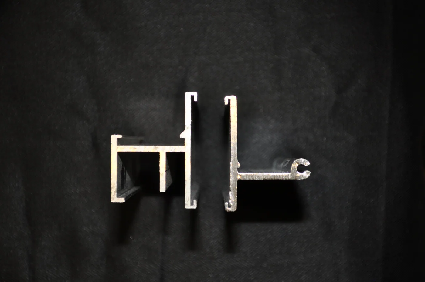 two commercially available extruded aluminum bar samples, both accept Color Strips in the face but the heavier bar with the extra struts allows Ice Stoppers to
