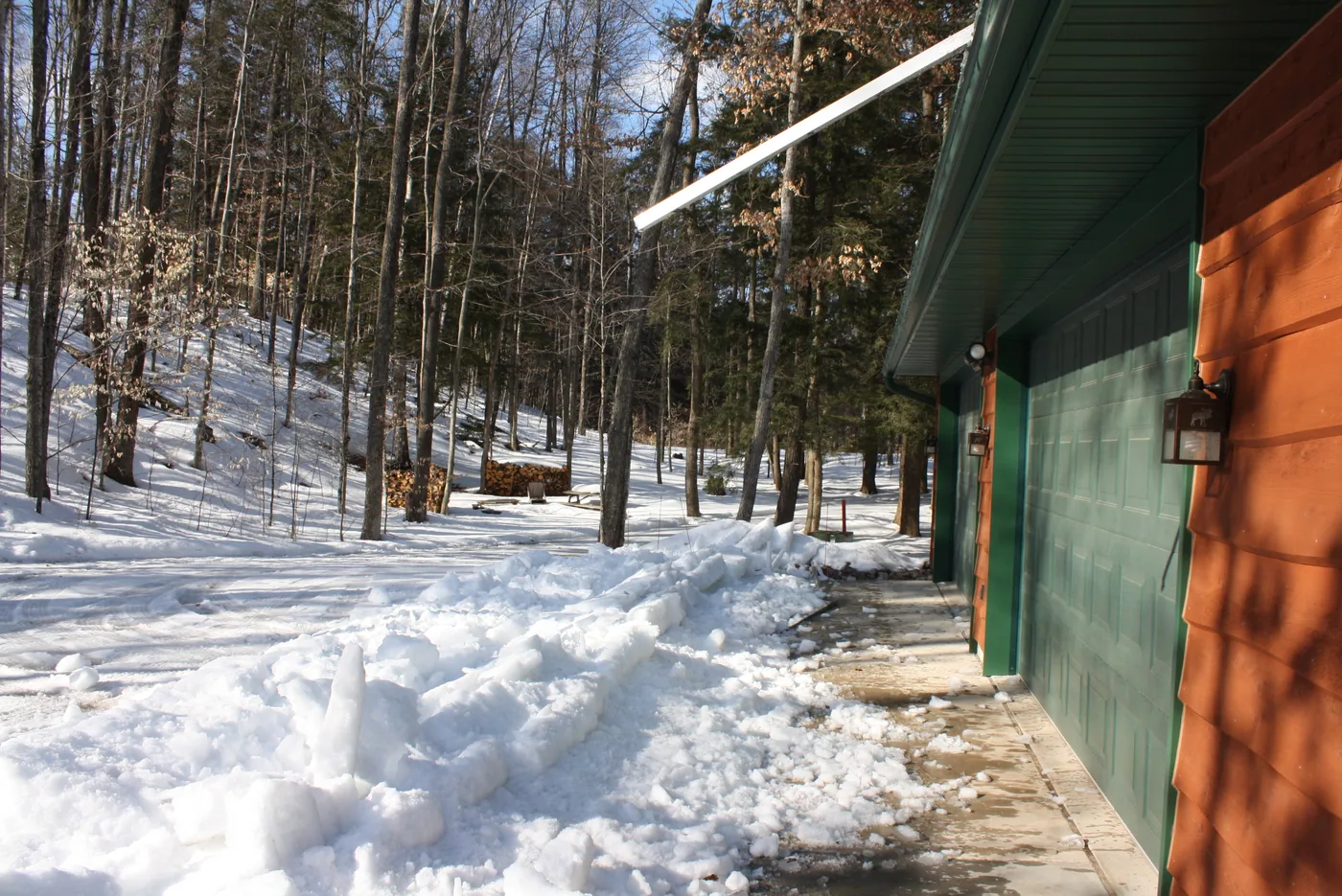 Installer-fabricated metal angle screwed through a watertight standing seam